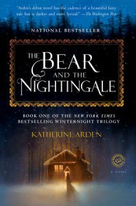 The cover of The Bear and the Nightingale, with a picture of a woman outside a cabin.